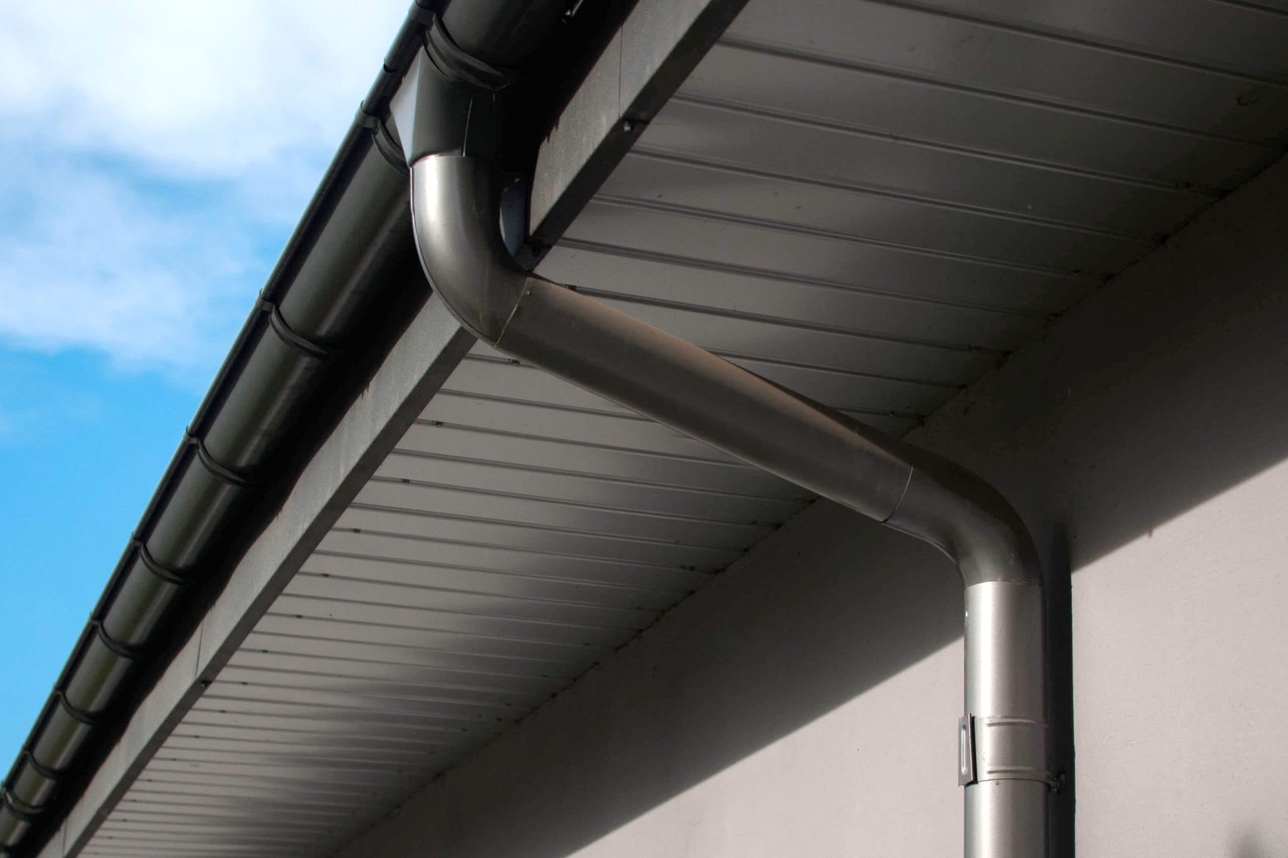 Corrosion-resistant galvanized gutters installed on a commercial building in Williamsburg